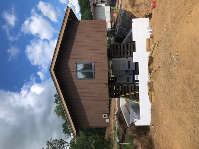 house floating above new laid foundation