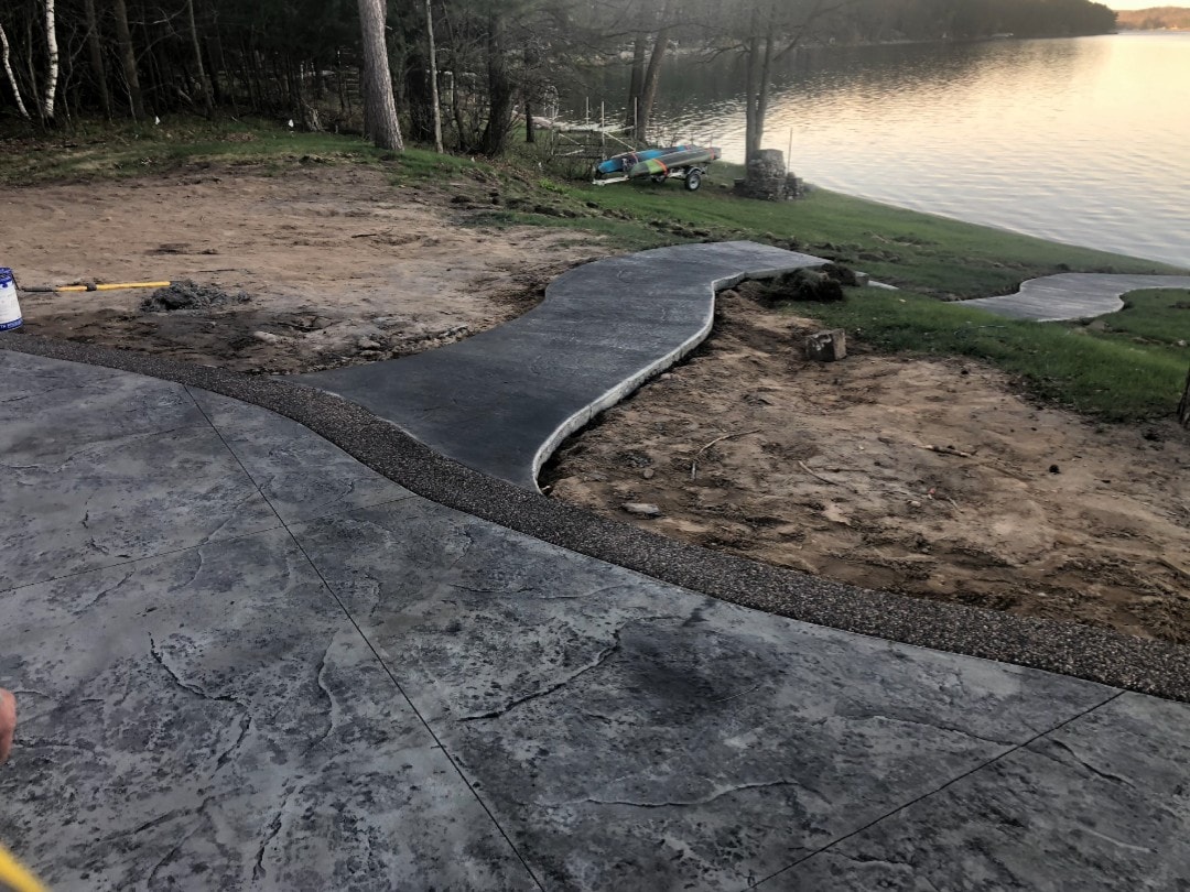 finished walkway to a lake